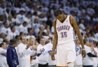 Oklahoma City Thunder forward Durant walks with his head down after a teammate fouled a Memphis Grizzlies player in Game 5 of their NBA Western Conference semi-final playoffs in Oklahoma City.